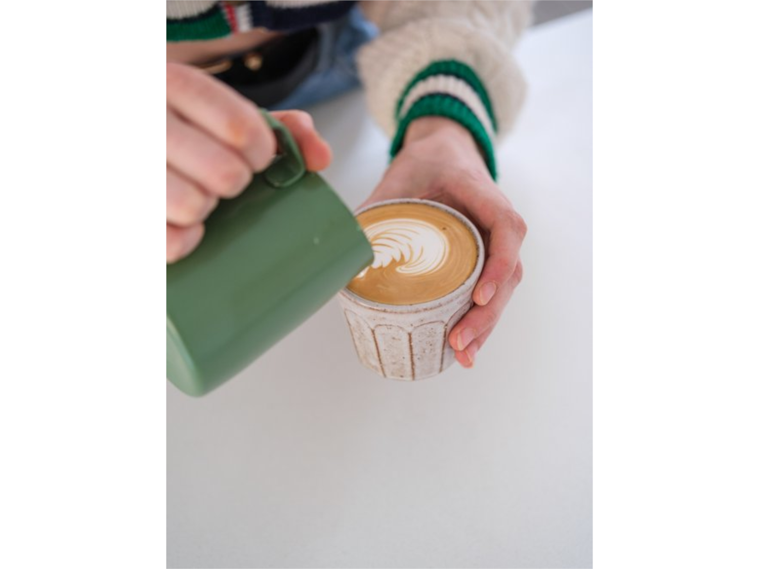 A cappuccino being poured at Kilnfolk Coffee