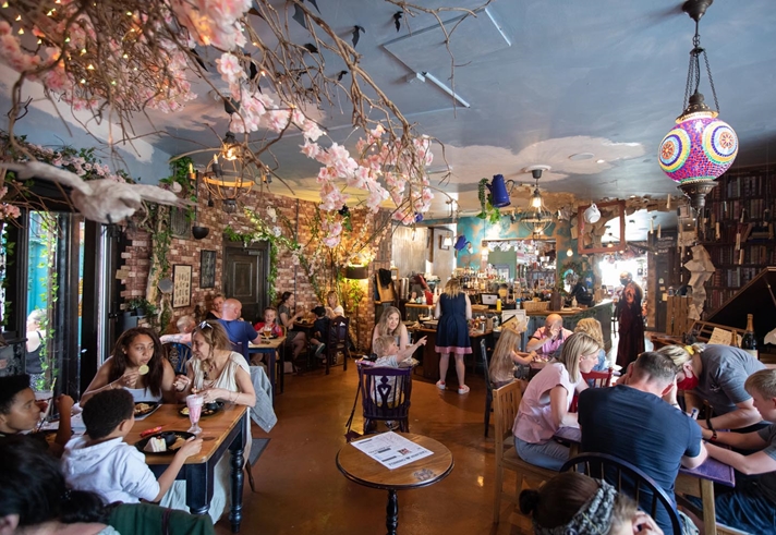 Interior of The Steel Cauldron. All the tables are filled with people eating and drinking.