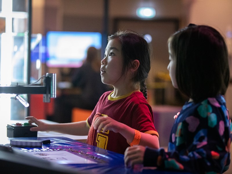 Two children playing games at The National Videogame Museum