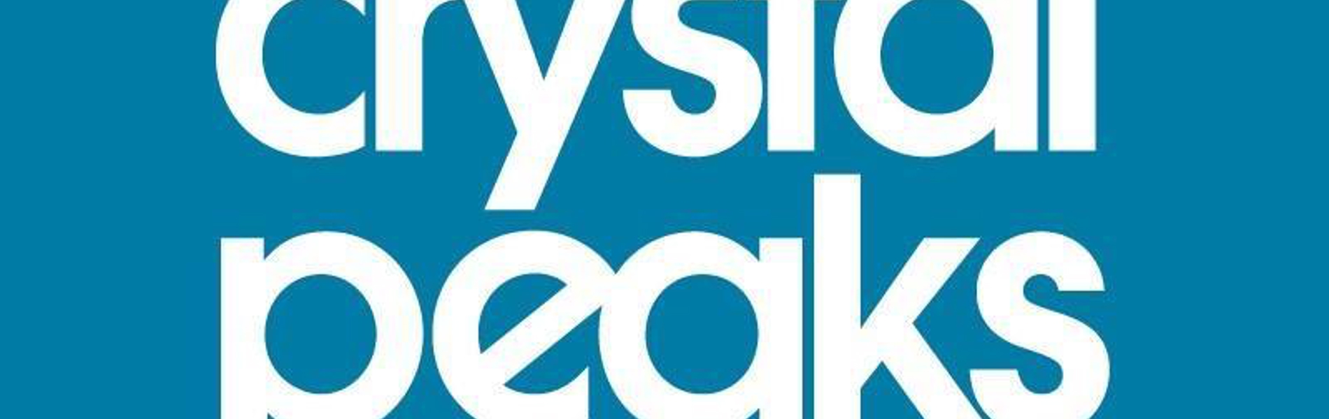 The Crystal Peaks Shopping centre logo which consists of the word Crystal Peaks Shopping, in white, on a blue background.