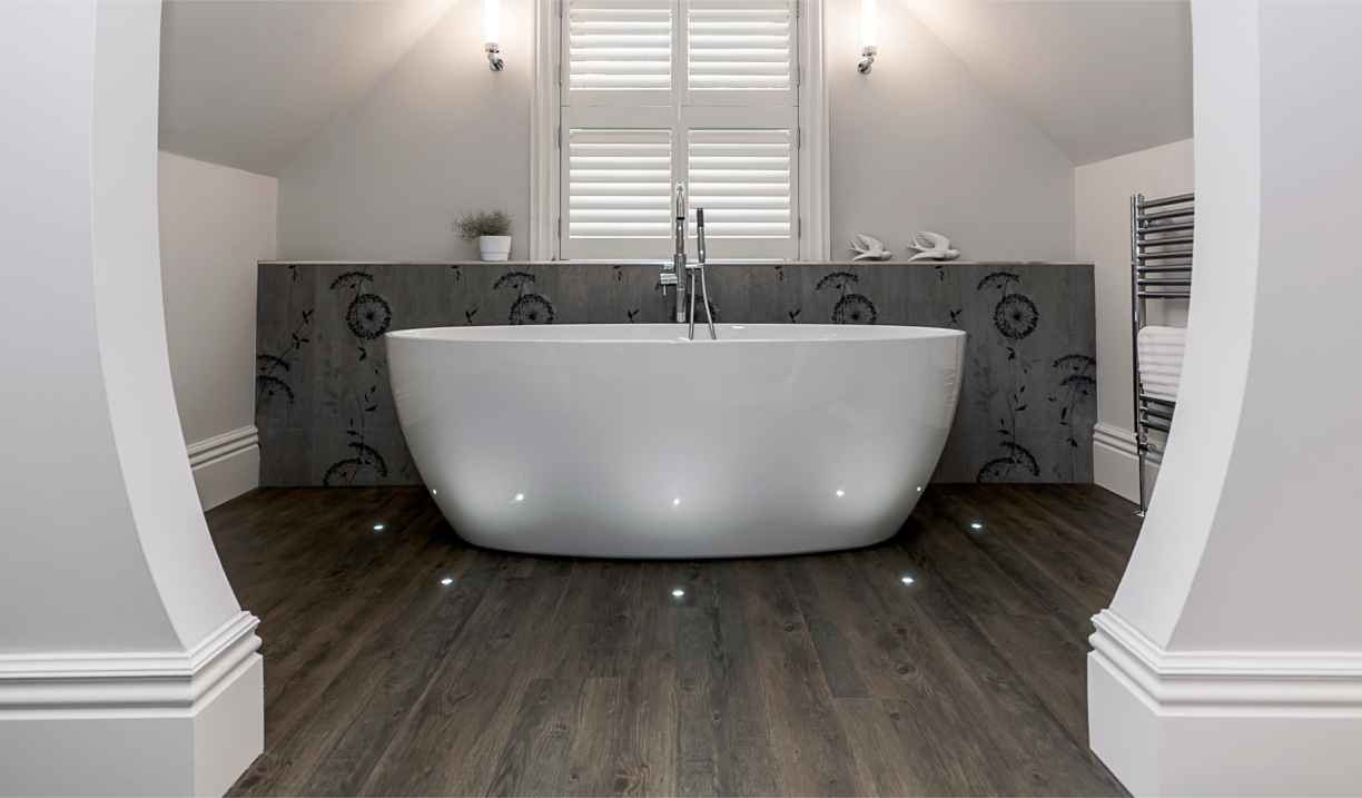 Spacious bathroom featuring a freestanding bathtub and modern fixtures.