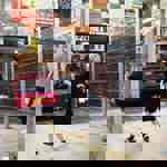 A woman and a boy playing football at Yard Ball.