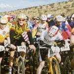 A group of people on a bike race.