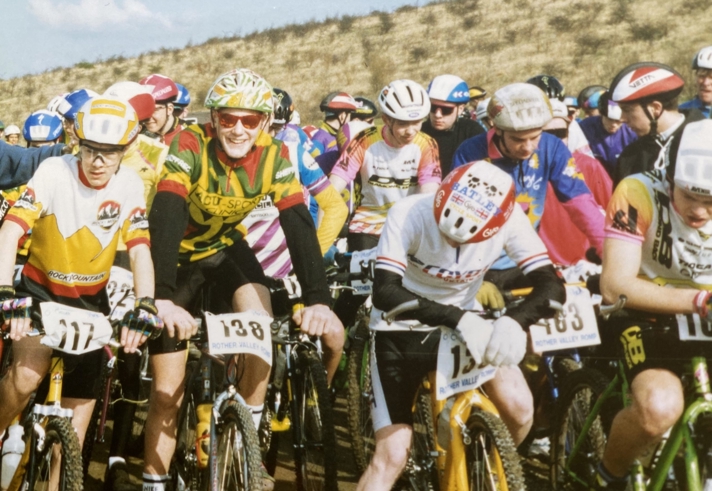 A group of people on a bike race.