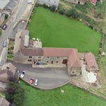 Aerial view of Padley Farm showing the exterior and surrounding landscape.