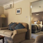 Sitting area at Mercure Tankersley Manor with comfortable chairs and a small table.
