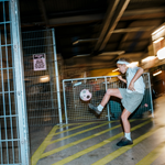 Children playing football at Yard Ball, an indoor football park.