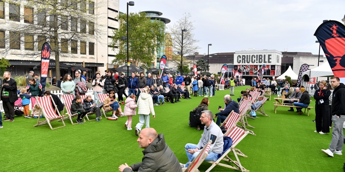 Tudor Square, in Sheffield city centre, is thronging with people, who have come to watch the snooker at The Crucible. Some people are sat on deck chairs watching the matches on a big screen.