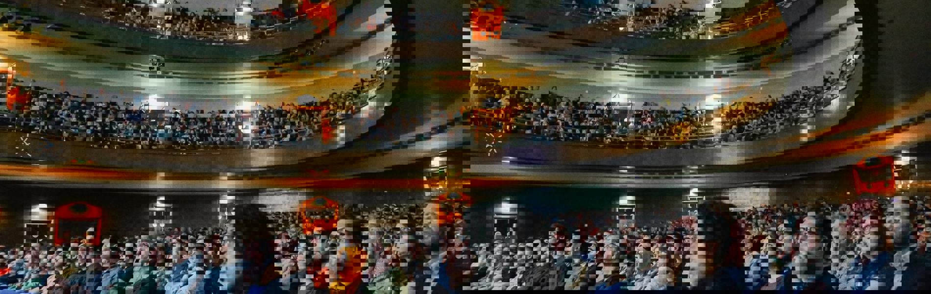 An audience inside the Oval Hall at The City Hall in Sheffield.