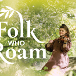 A person wearing a long, patterned dress sits outdoors on a fallen tree trunk, playing a violin in a lush, green woodland setting. Sunlight filters through the leaves, creating a soft, natural glow. Large stylized text reading “Folk Who Roam” appears on the left side of the image, with a decorative leaf motif integrated into the lettering. Credit: Cat Vinton