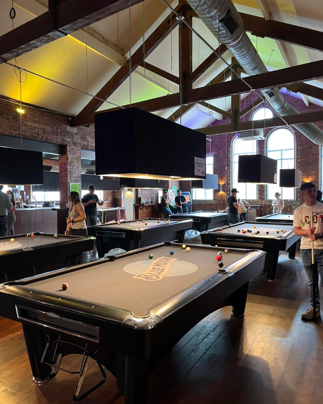 People playing pool at The Common Room.