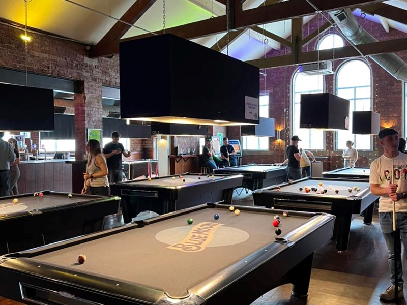 People playing pool at The Common Room.
