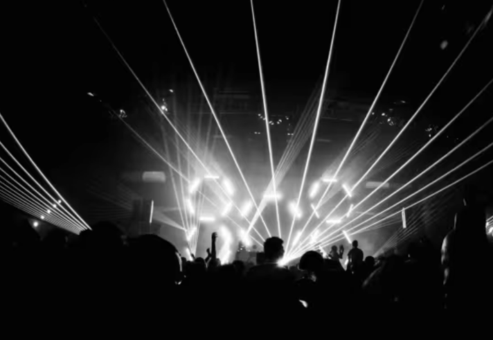People dancing at a concert.