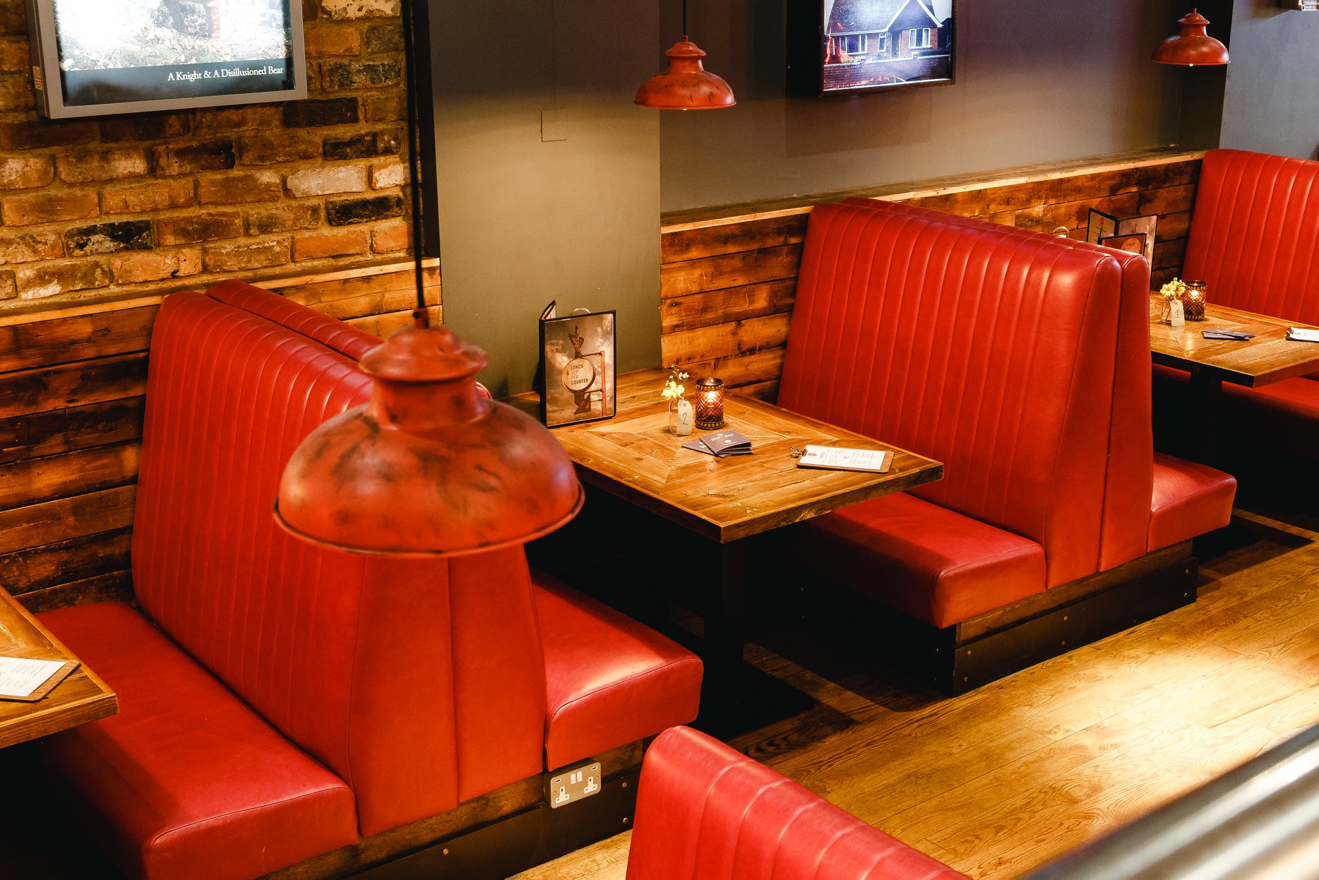 A row of booths at Bungalows & Bears.