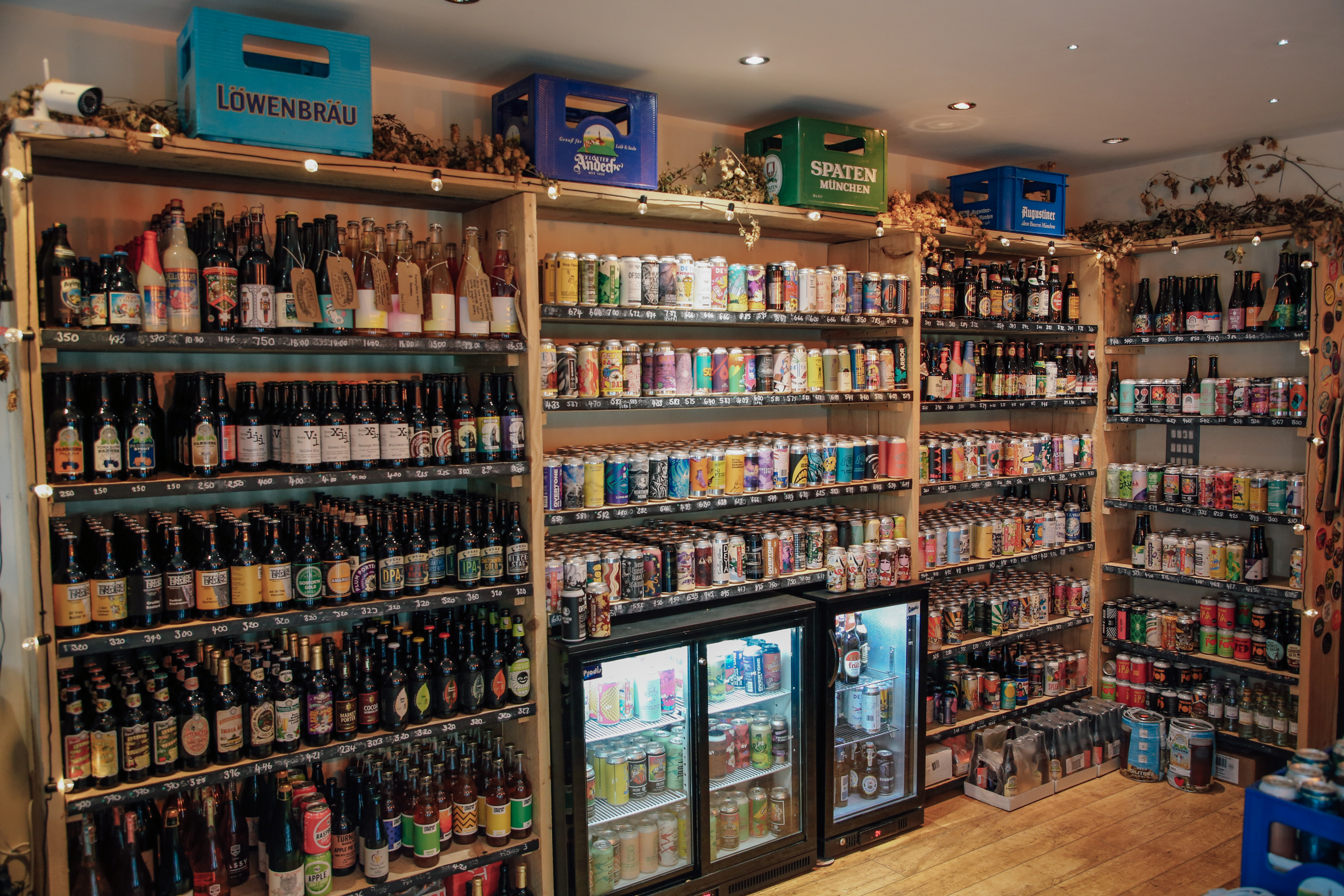 Inside Turner's Bottle Shop & Tap, the walls are taken up with shelving and chiller cabinets, all filled with bottles and cans.