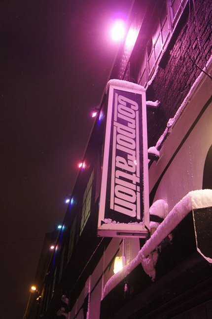 The Corporation sign on the side of the building.