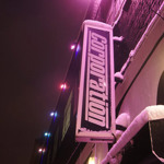 The Corporation sign on the side of the building.