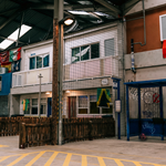 An interior shot of Yard Ball that has been made to look like an outdoor setting of a street with shops.