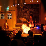 A band plays live in The Lescar.