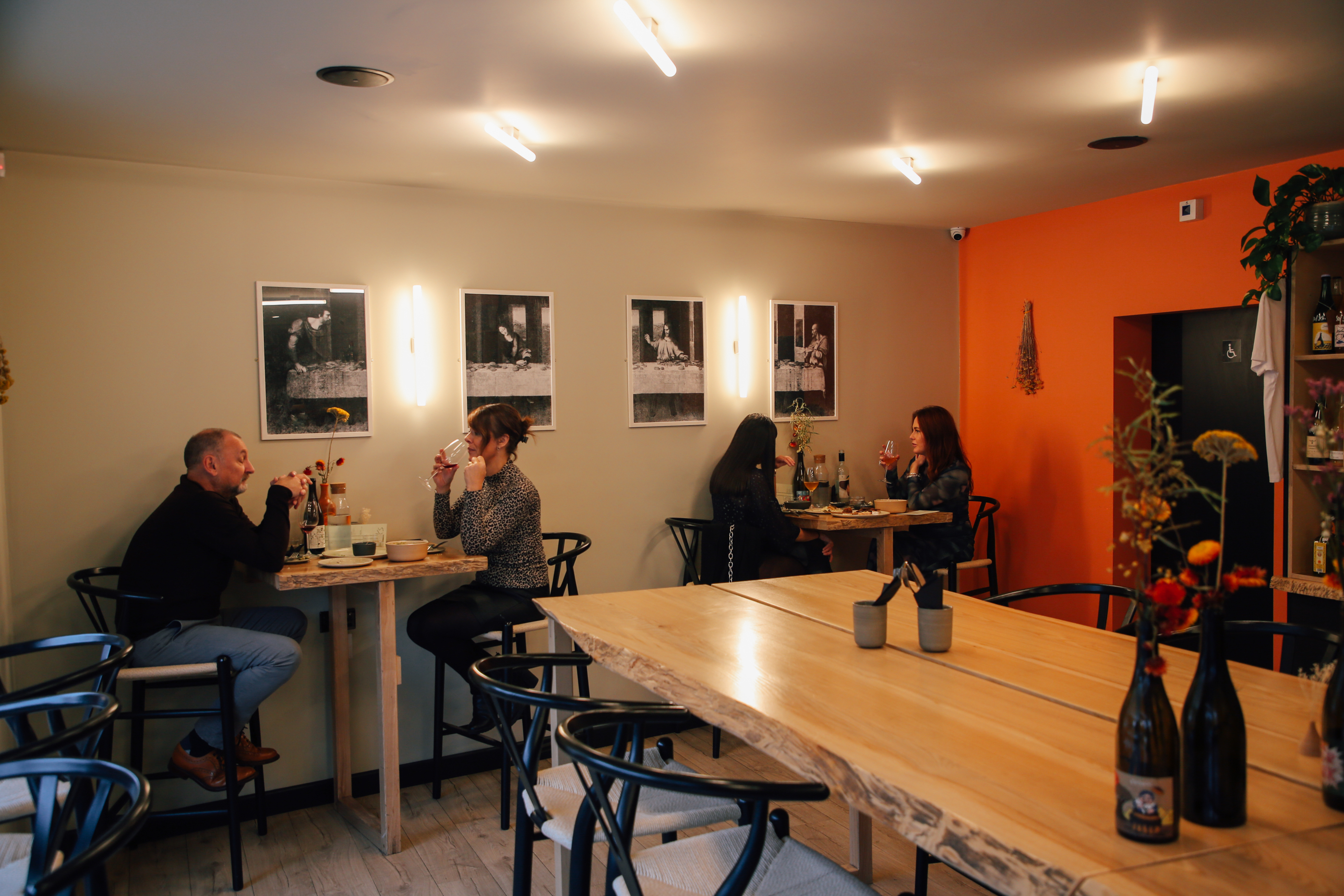 Interior of Bench with people sat at tables.