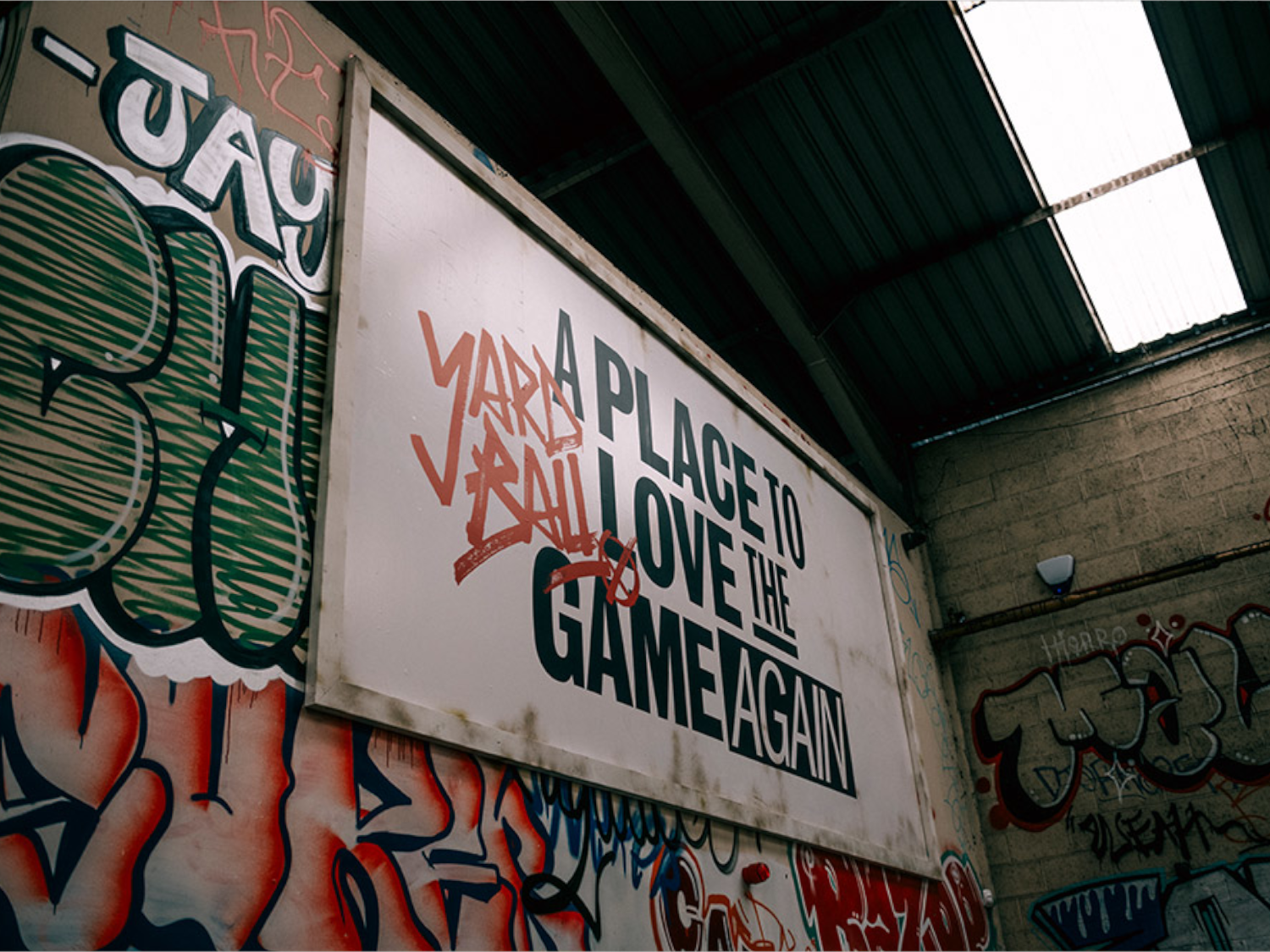 An interior shot of Yard Ball that has been made to look like an outdoor setting of a street with shops.