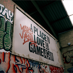 An interior shot of Yard Ball that has been made to look like an outdoor setting of a street with shops.