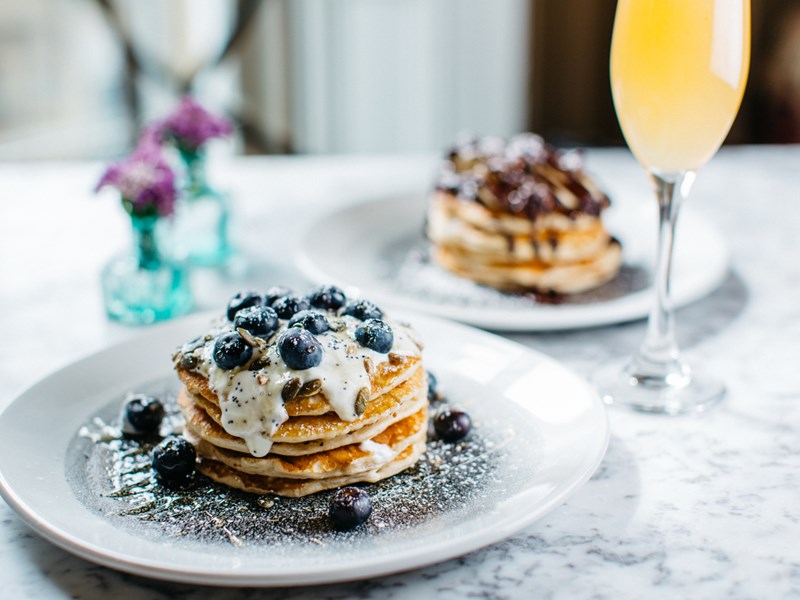 A stack of blueberry pancakes.