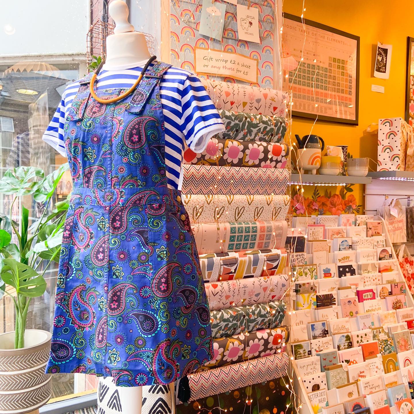 A mannequin wearing a blue paisley dress at Mookau. 