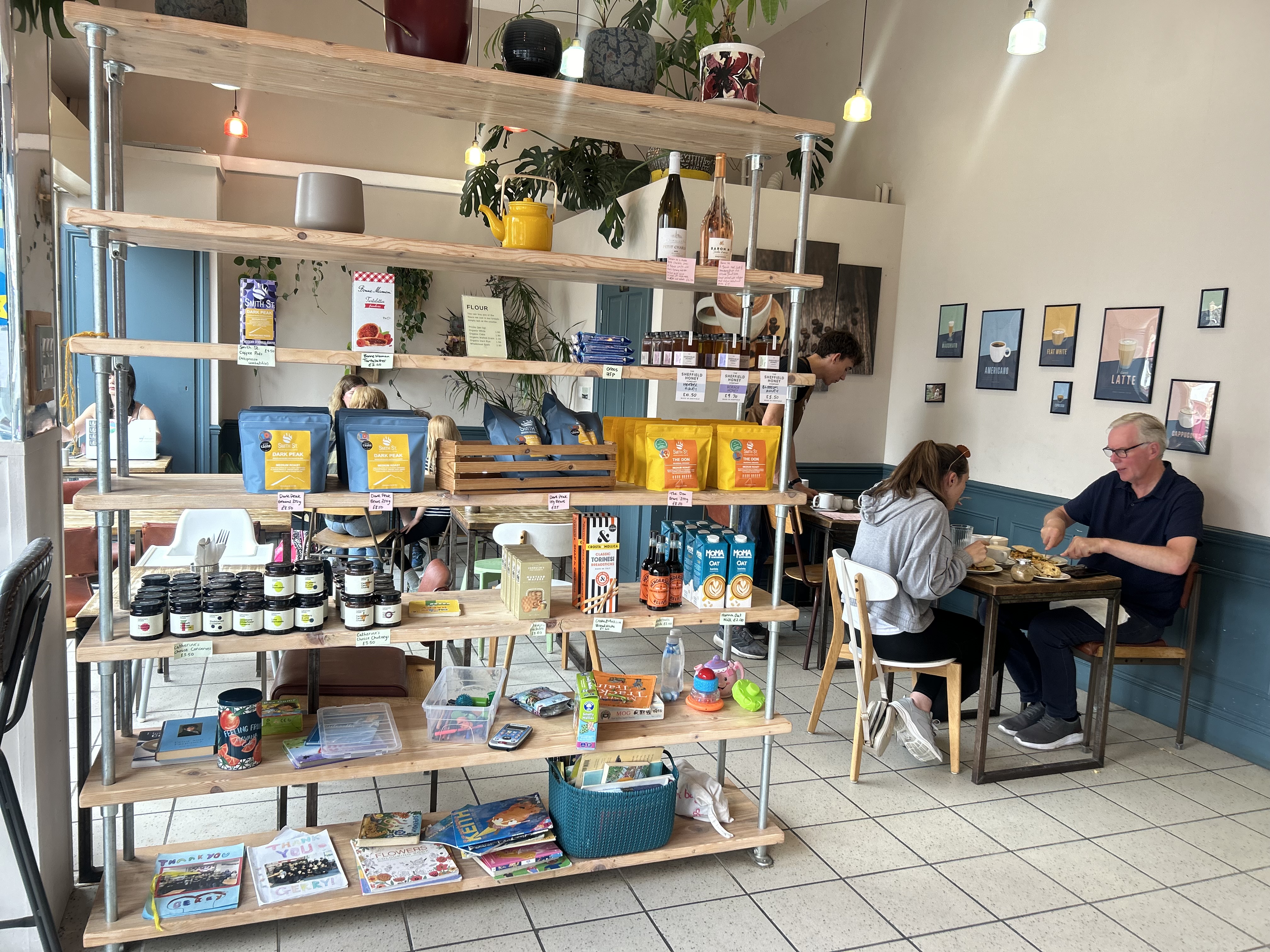 A photo of the inside of the cafe, with some of the stuff stocked up on shelves