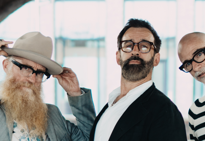 Three men, all with beards and glasses.