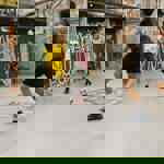 Four boys play indoor football at Yard Ball.