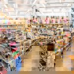 Inside the Fred Aldous Sheffield shop. There are rows of display units filled with art supplies.
