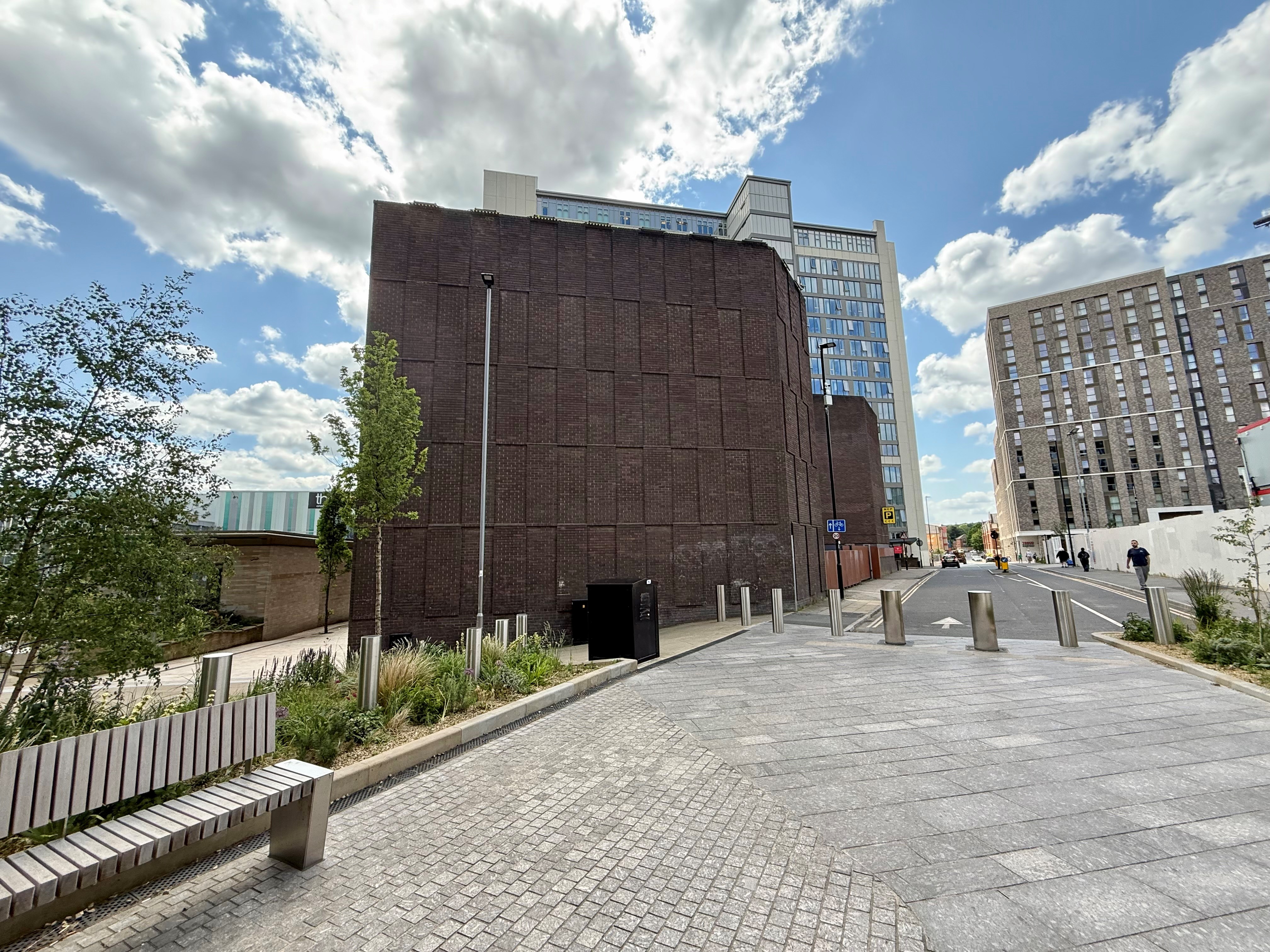 Looking towards the geometric brick work of the NCP building on Wellington Street in Sheffield