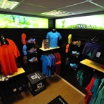 Inside the myRaceKit North shop, with lots of shelves and clothes rails full of running shoes and clothing.