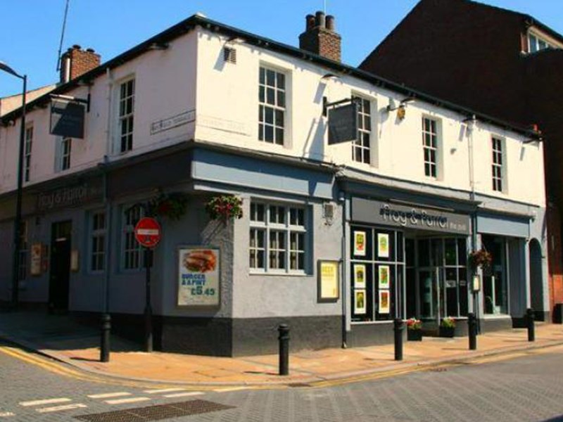 Exterior of The Frog and Parrot pub.