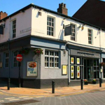 Exterior of The Frog and Parrot pub.