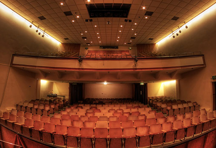 A view of the Montgomery theatre, from the back, looking across the seating, towards the stage.