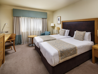 Mercure Sheffield Parkway Hotel twin room with two cosy beds and bright interior.