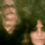 A shaky and blurred photo of two people.