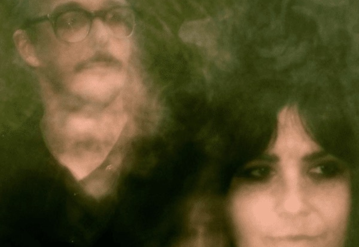 A shaky and blurred photo of two people.