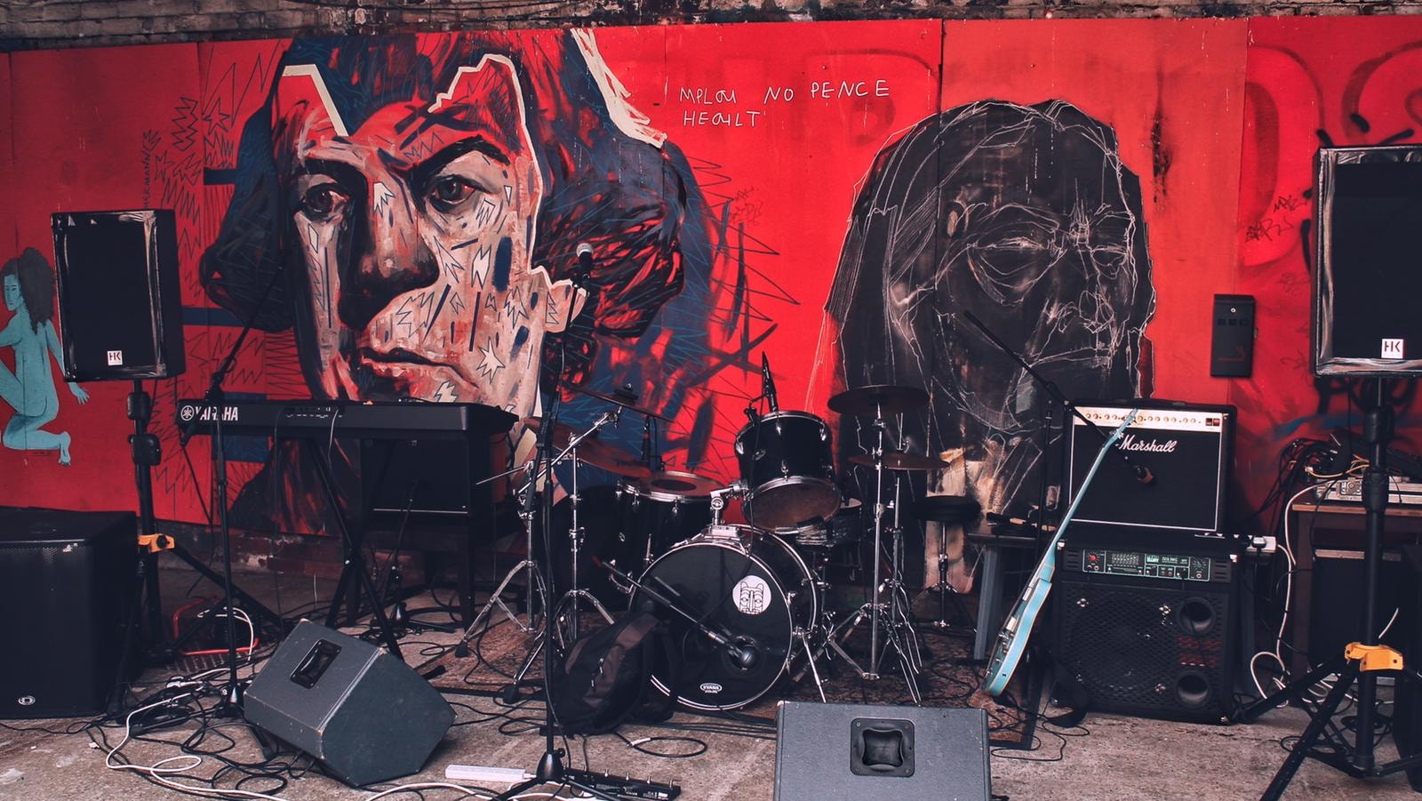 A small stage full of musical equipment, ready for a gig.