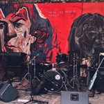 A small stage full of musical equipment, ready for a gig.