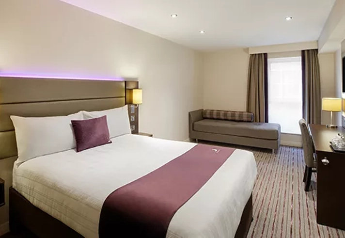 Premier Inn Sheffield Arena – double room with signature purple decor.