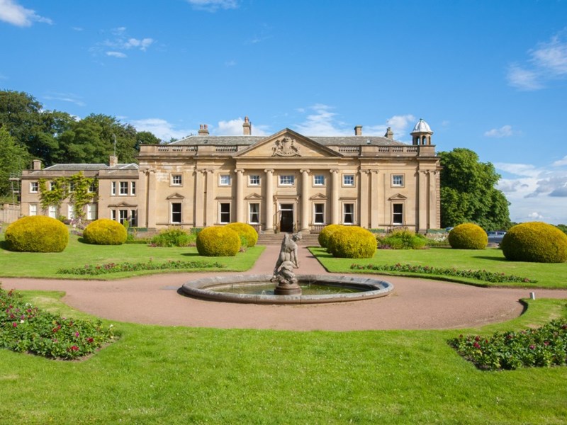 Front exterior of Wortley Hall stately home, showcasing its historic architecture and landscaped grounds.