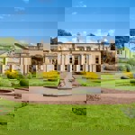 Front exterior of Wortley Hall stately home, showcasing its historic architecture and landscaped grounds.