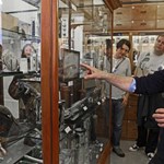 A group of people having a guided tour around The Alfred Denny Museum Of Zoology.