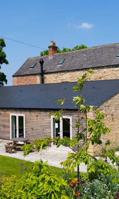 An exterior photo of the back of Manor Oaks House.