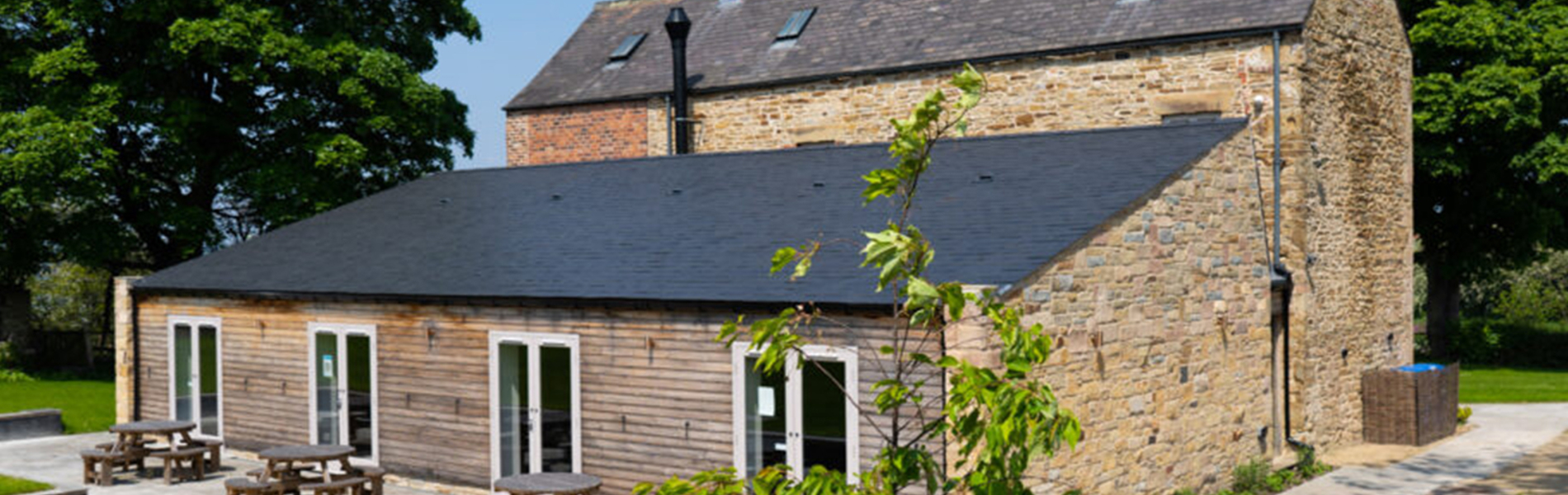 An exterior photo of the back of Manor Oaks House.