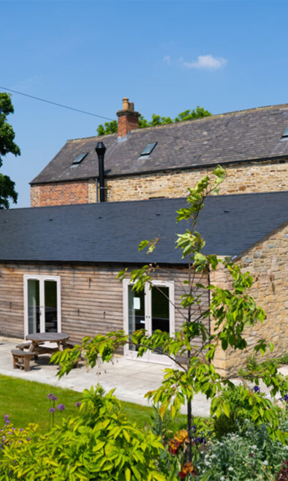 An exterior photo of the back of Manor Oaks House.