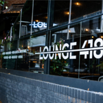 Lounge 418 window with their logo.